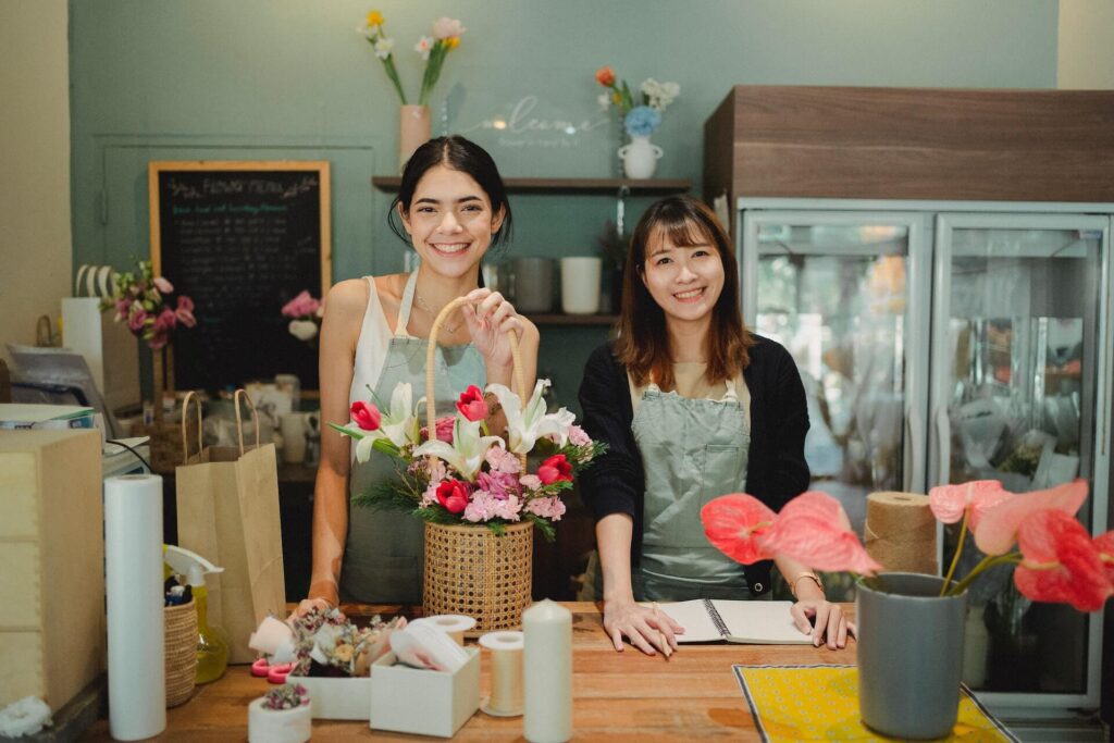 Smiling florists standing at the counter
