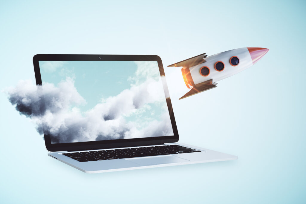 A laptop with a rocket flying over