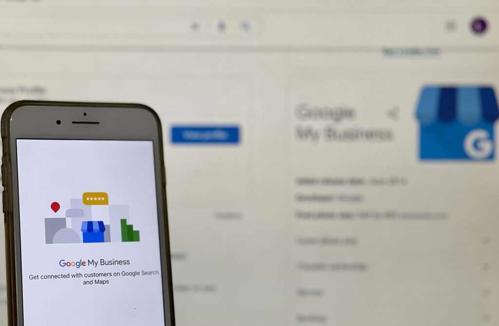 Google My Business app with a computer screen in the background
